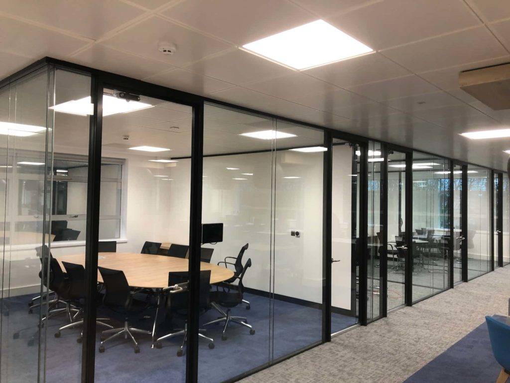 Row of separate offices with framed glass partitions